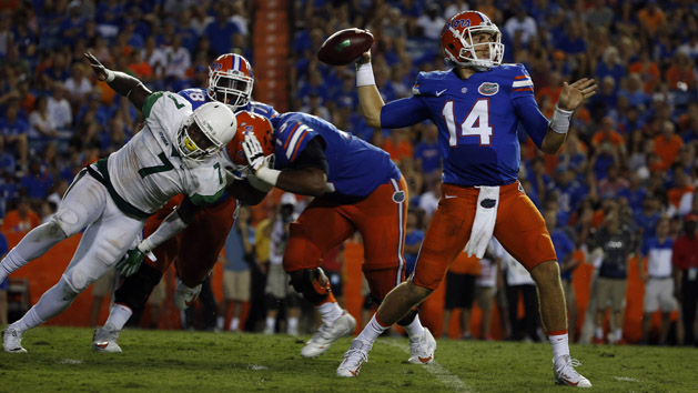 Sep 17, 2016; Gainesville, FL, USA; Florida Gators quarterback Luke Del Rio (14) thows the ball as North Texas Mean Green defensive end Jareid Combs (7) rushes during the second half at Ben Hill Griffin Stadium. Florida Gators defeated the North Texas Mean Green 32-0. Photo Credit: Kim Klement-USA TODAY Sports