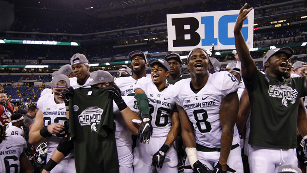 Dec 5, 2015; Indianapolis, IN, USA; Michigan State players celebrate after defeating the Iowa Hawkeyes during in the Big Ten Conference football championship game at Lucas Oil Stadium. Mandatory Credit: Brian Spurlock-USA TODAY Sports