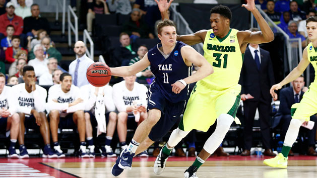 Mar 17, 2016; Providence, RI, USA; Yale Bulldogs guard Makai Mason (11) drives against Baylor Bears forward Terry Maston (31) during the first half of a first round game during the 2016 NCAA Tournament at Dunkin Donuts Center. Mandatory Credit: Mark L. Baer-USA TODAY Sports
