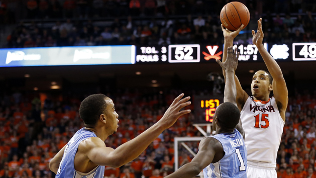 Feb 27, 2016; Charlottesville, VA, USA; Virginia Cavaliers guard Malcolm Brogdon (15) shoots the ball over North Carolina Tar Heels forward Theo Pinson (1) in the second half at John Paul Jones Arena. The Cavaliers won 79-74. Mandatory Credit: Geoff Burke-USA TODAY Sports