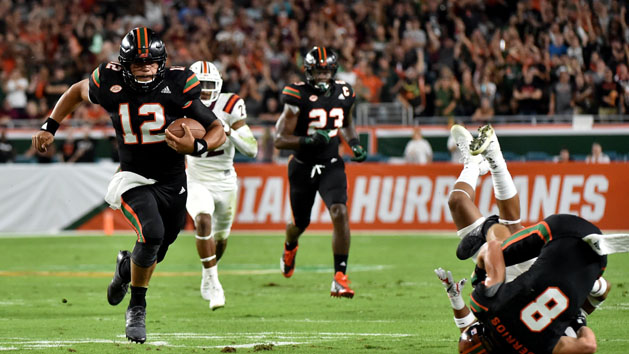 Nov 4, 2017; Miami Gardens, FL, USA; Miami Hurricanes quarterback Malik Rosier (12) carries the ball against the Virginia Tech Hokies during the first half at Hard Rock Stadium. Photo Credit: Steve Mitchell-USA TODAY Sports