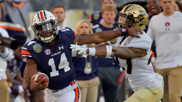 Dec 28, 2018; Nashville, TN, USA; Auburn Tigers quarterback Malik Willis (14) rushes against the Purdue Boilermakers during the second half of the 2018 Music City Bowl at Nissan Stadium. Auburn won 63-14. Mandatory Credit: Jim Brown-USA TODAY Sports