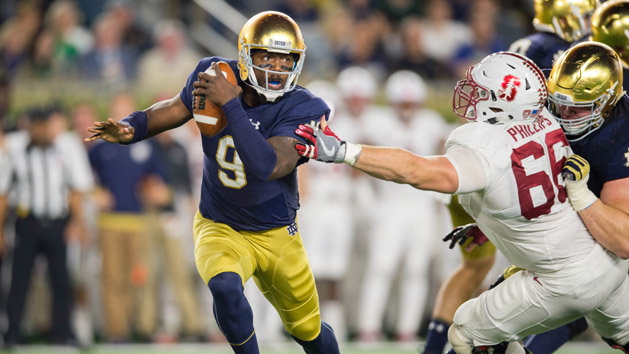 Oct 15, 2016; South Bend, IN, USA; Notre Dame Fighting Irish quarterback Malik Zaire (9) is pressured by Stanford Cardinal defensive tackle Harrison Phillips (66) in the third quarter at Notre Dame Stadium. Stanford won 17-10. Photo Credit: Matt Cashore-USA TODAY Sports