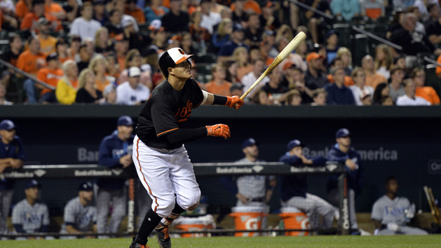 Jun 24, 2016; Baltimore, MD, USA; Baltimore Orioles third baseman Manny Machado (13) hits a solo home run during the eighth inning against the Tampa Bay Rays at Oriole Park at Camden Yards. Baltimore Orioles defeated Tampa Bay Rays 6-3. Mandatory Credit: Tommy Gilligan-USA TODAY Sports