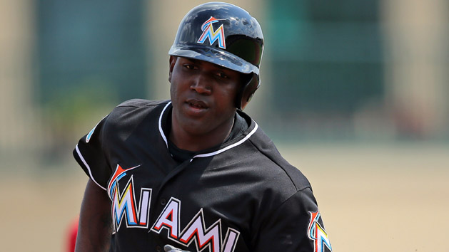 Mar 3, 2016; Jupiter, FL, USA; Miami Marlins center fielder Marcell Ozuna (13) rounds the bases after hitting a solo home run against the St. Louis Cardinals during a spring training game at Roger Dean Stadium. Mandatory Credit: Steve Mitchell-USA TODAY Sports