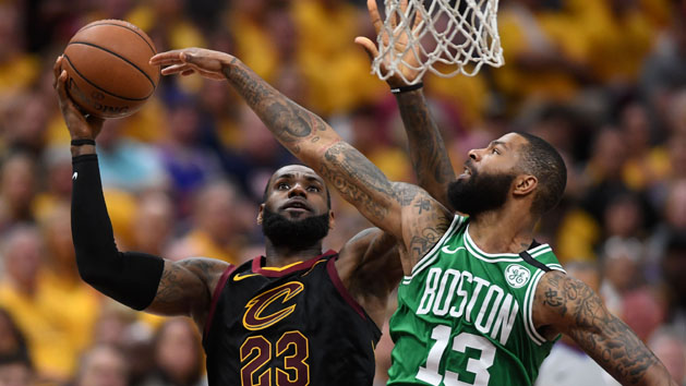 May 21, 2018; Cleveland, OH, USA; Cleveland Cavaliers forward LeBron James (23) attempts a layup in front of Boston Celtics forward Marcus Morris (13) during the third quarter in game four of the Eastern conference finals of the 2018 NBA Playoffs at Quicken Loans Arena. Photo Credit: Ken Blaze-USA TODAY Sports