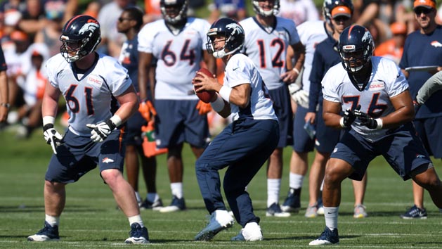 Jul 28, 2016; Englewood, CO, USA; Denver Broncos center Matt Paradis (61) and offensive guard Max Garcia (76) and quarterback Mark Sanchez (6) during training camp drills held at the UCHealth Training Center. Photo Credit: Ron Chenoy-USA TODAY Sports