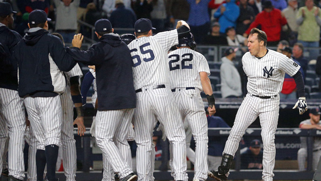 Sep 28, 2016; Bronx, NY, USA; New York Yankees first baseman Mark Teixeira (25) celebrates with teammates after hitting a walk off grand slam against the Boston Red Sox during the ninth inning at Yankee Stadium. Photo Credit: Brad Penner-USA TODAY Sports