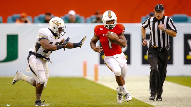 Nov 21, 2015; Miami Gardens, FL, USA; Georgia Tech Yellow Jackets linebacker P.J. Davis (40) pushes Miami Hurricanes running back Mark Walton (1) out of bounce during the second half at Sun Life Stadium. Mandatory Credit: Steve Mitchell-USA TODAY Sports