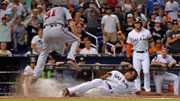 Jun 21, 2017; Miami, FL, USA; Miami Marlins relief pitcher Jose Urena (62) scores the tying run on a wild pitch by Washington Nationals starting pitcher Max Scherzer (31) in the eighth inning at Marlins Park. Photo Credit: Jasen Vinlove-USA TODAY Sports