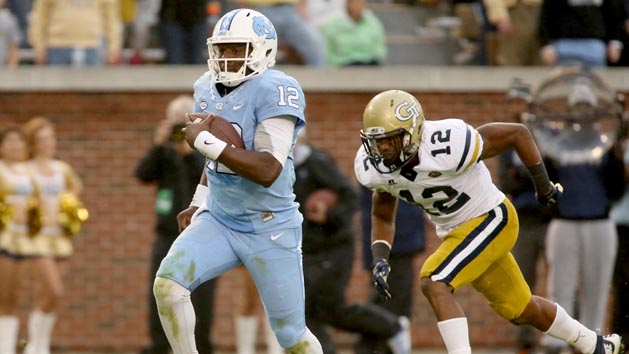 Oct 3, 2015; Atlanta, GA, USA; North Carolina Tar Heels quarterback Marquise Williams (12) runs past Georgia Tech Yellow Jackets defensive back Demond Smith (12) for a touchdown in the fourth quarter of their game at Bobby Dodd Stadium. North Carolina won 38-31. Mandatory Credit: Jason Getz-USA TODAY Sports