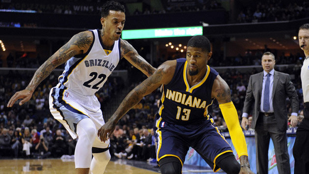 Dec 19, 2015; Memphis, TN, USA; Indiana Pacers forward Paul George (13) handles the ball against Memphis Grizzlies forward Matt Barnes (22) during the first quarter at FedExForum. Mandatory Credit: Justin Ford-USA TODAY Sports
