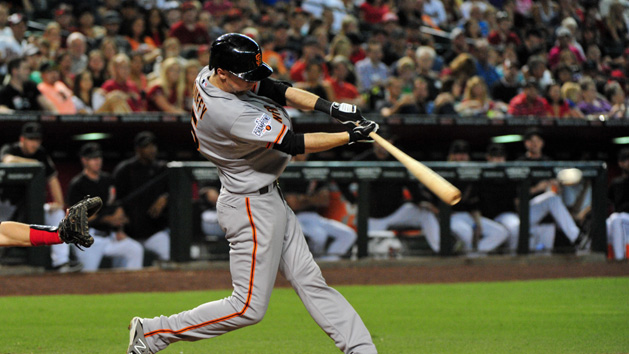 Jul 18, 2015; Phoenix, AZ, USA; San Francisco Giants third baseman Matt Duffy (5) singles in the third inning against the Arizona Diamondbacks at Chase Field. Mandatory Credit: Matt Kartozian-USA TODAY Sports