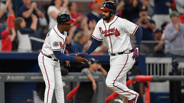Sep 7, 2017; Atlanta, GA, USA; Atlanta Braves left fielder Matt Kemp (27) (right) shakes hands with third base coach Ron Washington (37) after hitting a home run against the Miami Marlins during the fifth inning at SunTrust Park. Photo Credit: Dale Zanine-USA TODAY Sports