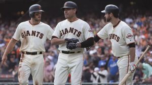Moore, Posey help Giants wrap up wild card