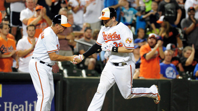 Aug 30, 2016; Baltimore, MD, USA; Baltimore Orioles catcher Matt Wieters (32) high fives third base coach Bobby Dickerson (11) after hitting a home run in the eighth inning against the Toronto Blue Jays at Oriole Park at Camden Yards. Photo Credit: Evan Habeeb-USA TODAY Sports