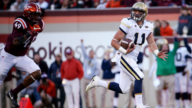 Nov 12, 2016; Blacksburg, VA, USA; Georgia Tech Yellow Jackets quarterback Matthew Jordan (11) runs for a touchdown during the second quarter against Virginia Tech Hokies linebacker Tremaine Edmunds (49) during the second quarter at Lane Stadium. Photo Credit: Peter Casey-USA TODAY Sports