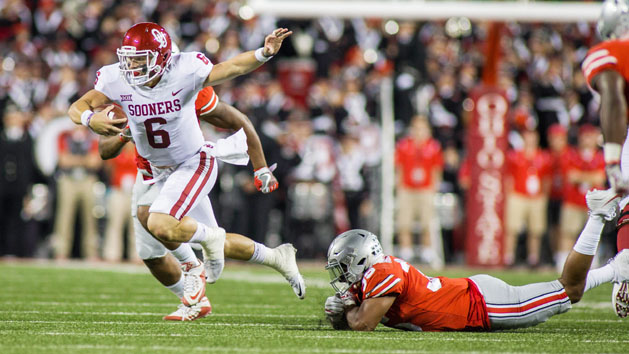 Sep 9, 2017; Columbus, OH, USA; Oklahoma Sooners quarterback Baker Mayfield (6) runs out of the tackle by Ohio State Buckeyes linebacker Malik Harrison (39) in the first half of the game at Ohio Stadium. Photo Credit: Trevor Ruszkowski-USA TODAY Sports
