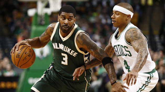 Feb 25, 2016; Boston, MA, USA; Milwaukee Bucks guard O.J. Mayo (3) dribbles the ball as Boston Celtics guard Isaiah Thomas (4) defends during the first half at TD Garden. Mandatory Credit: Mark L. Baer-USA TODAY Sports