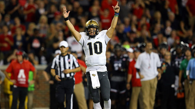 Oct 7, 2017; Cincinnati, OH, USA; UCF Knights quarterback McKenzie Milton (10) reacts to throwing a touchdown pass against the Cincinnati Bearcats in the first half at Nippert Stadium. Photo Credit: Aaron Doster-USA TODAY Sports