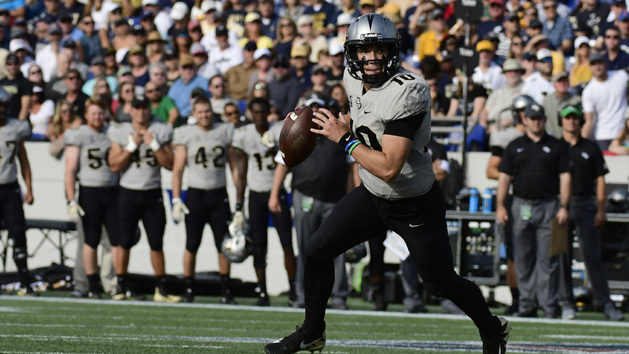 Oct 21, 2017; Annapolis, MD, USA; UCF Knights quarterback McKenzie Milton (10) rolls out to pass during the first quarter against the Navy Midshipmen at Navy-Marine Corps Memorial Stadium. Photo Credit: Tommy Gilligan-USA TODAY Sports