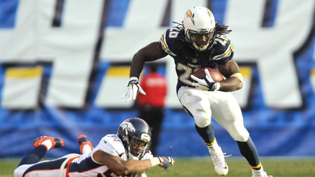 Dec 6, 2015; San Diego, CA, USA; San Diego Chargers running back Melvin Gordon (28) runs the ball ahead of Denver Broncos outside linebacker Brandon Marshall (54) during the second half of the game at Qualcomm Stadium. Denver won 17-3. Mandatory Credit: Orlando Ramirez-USA TODAY Sports