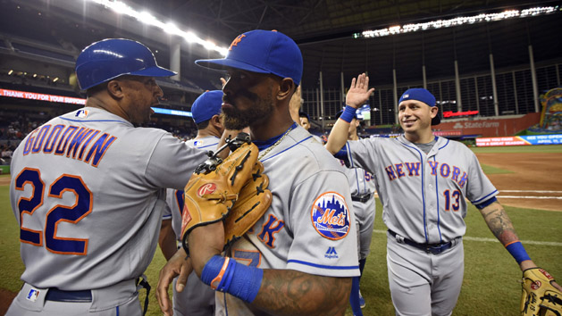 Sep 28, 2016; Miami, FL, USA; New York Mets first base coach Tom Goodwin (left) and third baseman Jose Reyes (center) and shortstop Asdrubal Cabrera (right) celebrate their 5-2 win over the Miami Marlins the at Marlins Park. Photo Credit: Steve Mitchell-USA TODAY Sports