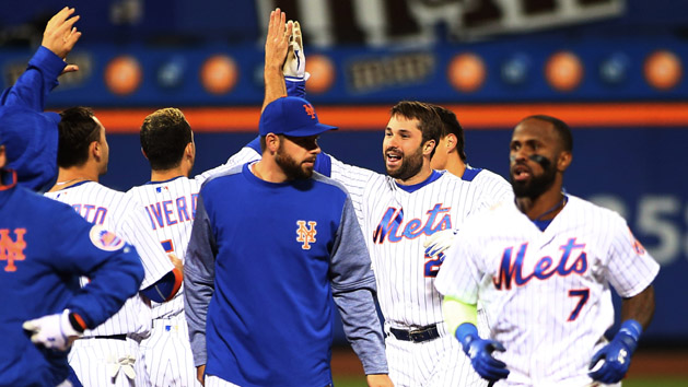 May 8, 2017; New York City, NY, USA; New York Mets second baseman Neil Walker (20) is congratulated by his teammates after hitting a game winning walkoff single against the San Francisco Giants during the ninth inning at Citi Field. Photo Credit: Andy Marlin-USA TODAY Sports