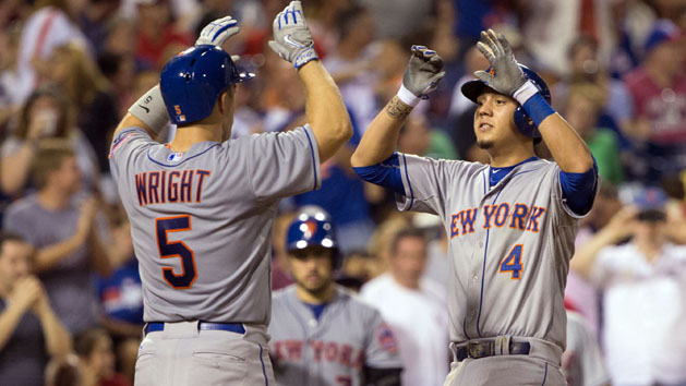 Aug 24, 2015; Philadelphia, PA, USA; New York Mets shortstop Wilmer Flores (4) high fives third baseman David Wright (5) after hitting a two RBI home run during the fourth inning against the Philadelphia Phillies at Citizens Bank Park. Mandatory Credit: Bill Streicher-USA TODAY Sports