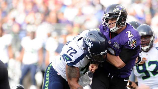 Dec 13, 2015; Baltimore, MD, USA; Baltimore Ravens quarterback Jimmy Clausen (2) is pressured by Seattle Seahawks defensive end Michael Bennett (72) in the second quarter at M&T Bank Stadium. Mandatory Credit: Evan Habeeb-USA TODAY Sports