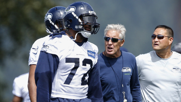 Jul 30, 2016; Renton, WA, USA; Seattle Seahawks head coach Pete Carroll speaks with defensive end Michael Bennett (72) during training camp at the Virginia Mason Athletic Center. Photo Credit: Joe Nicholson-USA TODAY Sports