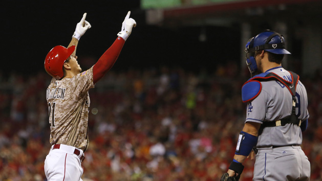 Aug 19, 2016; Cincinnati, OH, USA; Cincinnati Reds relief pitcher Michael Lorenzen (21) reacts next to Los Angeles Dodgers catcher Yasmani Grandal (9) after Lorenzen hit his first career home run, a three-run home run, during the seventh inning at Great American Ball Park. The Reds won 9-2. Photo Credit: David Kohl-USA TODAY Sports
