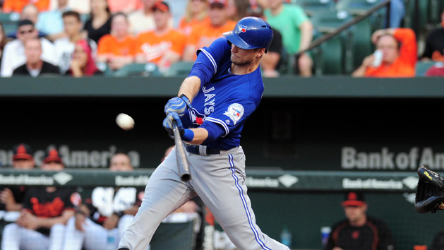 Jun 17, 2016; Baltimore, MD, USA; Toronto Blue Jays outfielder Michael Saunders (21) hits a three run home run in the first inning against the Baltimore Orioles at Oriole Park at Camden Yards. Mandatory Credit: Evan Habeeb-USA TODAY Sports