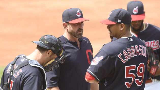 Apr 16, 2017; Cleveland, OH, USA; Cleveland Indians pitching coach Mickey Callaway (32) visits starting pitcher Carlos Carrasco (59) in the third inning at Progressive Field. Photo Credit: David Richard-USA TODAY Sports