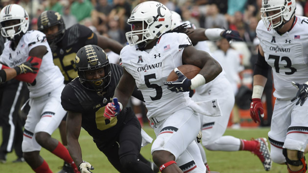 Sep 10, 2016; West Lafayette, IN, USA; Cincinnati Bearcats running back Mike Boone (5) runs past Purdue Boilermakers cornerback Myles Norwood (6) in the second half at Ross Ade Stadium. Cincinnati won 38-20. Photo Credit: Sandra Dukes-USA TODAY Sports