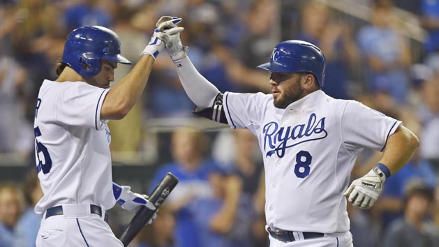 Mike Moustakas (8) celebrates with teammate Eric Hosmer (35) after hitting a home run against the Pittsburgh Pirates during the seventh inning at Kauffman Stadium. Peter G. Aiken-USA TODAY Sports