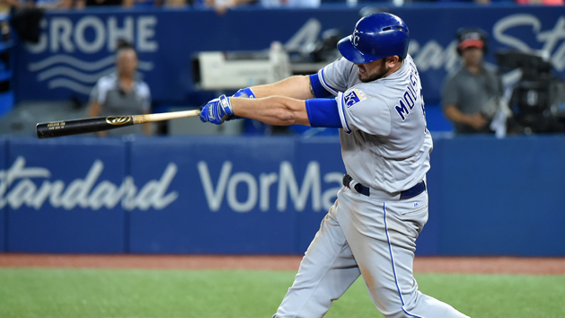 Sep 20, 2017; Toronto, Ontario, CAN; Kansas City Royals third baseman Mike Moustakas (8) hits a home run against the Toronto Blue Jays in the sixth inning at Rogers Centre. Photo Credit: Dan Hamilton-USA TODAY Sports