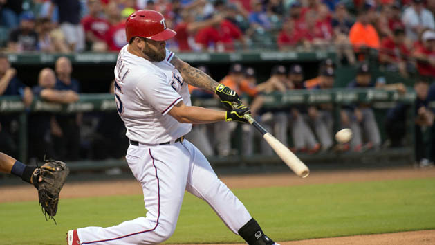 Sep 16, 2015; Arlington, TX, USA; Texas Rangers left fielder Mike Napoli (25) hits a three run home run against the Houston Astros during the first inning at Globe Life Park in Arlington. Mandatory Credit: Jerome Miron-USA TODAY Sports