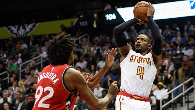 Apr 7, 2016; Atlanta, GA, USA; Atlanta Hawks forward Paul Millsap (4) shoots over Toronto Raptors center Lucas Nogueira (92) during the second half at Philips Arena. The Hawks defeated the Raptors 95-87. Mandatory Credit: Dale Zanine-USA TODAY Sports