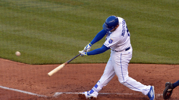 Apr 9, 2016; Kansas City, MO, USA; Kansas City Royals third baseman Mike Moustakas (8) connects for a solo home run in the fourth inning against the Minnesota Twins at Kauffman Stadium. Mandatory Credit: Denny Medley-USA TODAY Sports