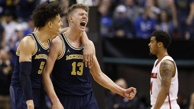 Mar 19, 2017; Indianapolis, IN, USA; Michigan Wolverines forward Moritz Wagner (13) and forward D.J. Wilson (5) celebrate during the second half in the second round of the 2017 NCAA Tournament against the Louisville Cardinals at Bankers Life Fieldhouse. Photo Credit: Brian Spurlock-USA TODAY Sports