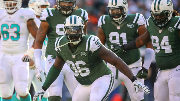 Nov 29, 2015; East Rutherford, NJ, USA; New York Jets defensive end Muhammad Wilkerson (96) celebrates his sack of Miami Dolphins quarterback Ryan Tannehill (not shown) during the first half at MetLife Stadium. Mandatory Credit: Ed Mulholland-USA TODAY Sports