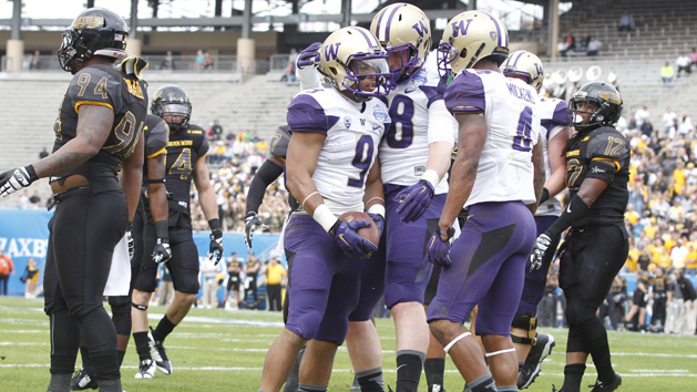 Dec 26, 2015; Dallas, TX, USA; Washington Huskies fullback Myles Gaskin (9) is congratulated after scoring a touchdown by tight end Drew Sample (88) and wide receiver Jaydon Mickens (4) in the first quarter against the Southern Miss Golden Eagles at Cotton Bowl Stadium. Mandatory Credit: Tim Heitman-USA TODAY Sports