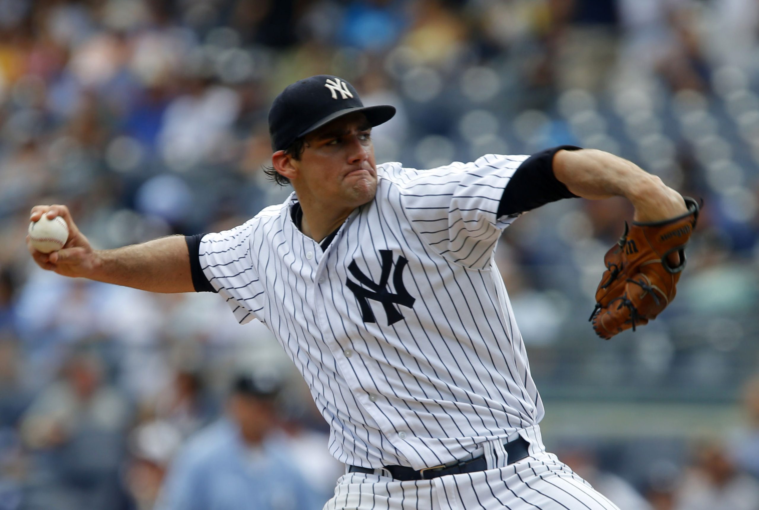 Aug 19, 2015; Bronx, NY, USA; New York Yankees starting pitcher Nathan Eovaldi (30) delivers a pitch against the Minnesota Twins in the first inning at Yankee Stadium. Mandatory Credit: Noah K. Murray-USA TODAY Sports