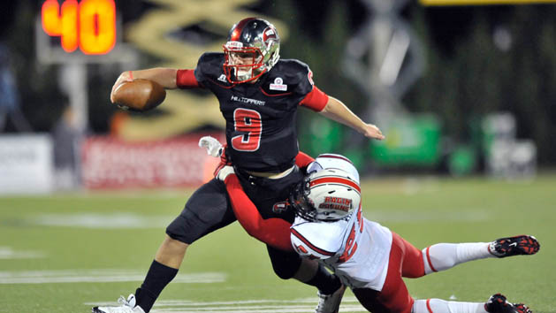 Oct 15, 2013; Bowling Green, KY, USA; Louisiana-Lafayette Ragin Cajuns safety Al Riles (25) tackles Western Kentucky Hilltoppers quarterback Nelson Fishback (9) during the second half at Houchens Industries-L.T. Smith Stadium. Louisiana-Lafayette won 37-20. Photo Credit: Jim Brown-USA TODAY Sports