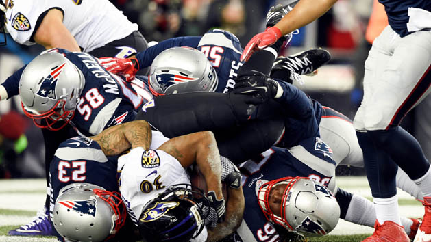 Dec 12, 2016; Foxborough, MA, USA; Baltimore Ravens running back Kenneth Dixon (30) is tackled for a safety by New England Patriots strong safety Patrick Chung (23), defensive tackle Malcom Brown (90), outside linebacker Shea McClellin (58), and outside linebacker Elandon Roberts (52) during the first half at Gillette Stadium. Photo Credit: Bob DeChiara-USA TODAY Sports