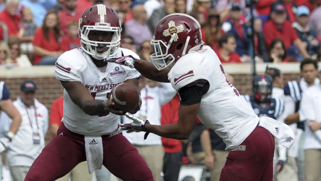 Oct 10, 2015; Oxford, MS, USA; New Mexico State Aggies quarterback Nick Jeanty (12) hands the ball off to running back Larry Rose III (3) during the game at Vaught-Hemingway Stadium. Photo Credit: Justin Ford-USA TODAY Sports