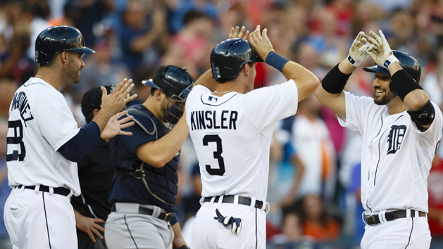 Jul 22, 2015; Detroit, MI, USA; Detroit Tigers third baseman Nick Castellanos (9) celebrates with second baseman Ian Kinsler (3) and right fielder J.D. Martinez (28) after hitting a grand slam in the third inning against the Seattle Mariners at Comerica Park. Mandatory Credit: Rick Osentoski-USA TODAY Sports