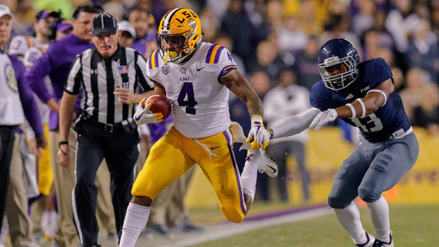 Nov 17, 2018; Baton Rouge, LA, USA; Rice Owls running back Collin Whitaker (13) pushes LSU Tigers running back Nick Brossette (4) out of bounds in the first quarter at Tiger Stadium. Photo Credit: Stephen Lew-USA TODAY Sports