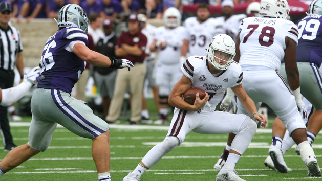 Sep 8, 2018; Manhattan, KS, USA; Mississippi State Bulldogs quarterback Nick Fitzgerald (7) carries the ball against Kansas State Wildcats defensive end Wyatt Hubert (56) during the fourth quarter at Bill Snyder Family Stadium. The Bulldogs won 31-10. Photo Credit: Scott Sewell-USA TODAY Sports